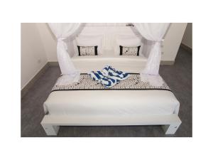 Кровать или кровати в номере KyGunAya Villa