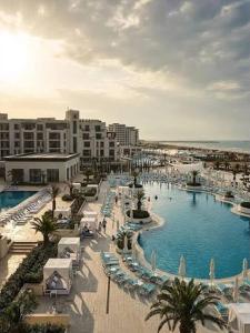 a view of a resort with a large swimming pool at Sea Breeze Baku in Baku +152 photos