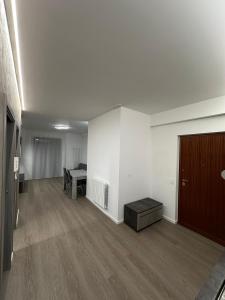 an empty room with a desk and a bed in a room at Grey loft in Torvaianica