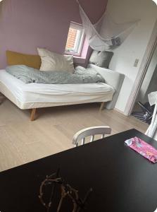 a living room with a couch and a table at Cozy house in Hasseris in Aalborg