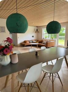 a dining room with a table and chairs at Cozy house in Hasseris in Aalborg