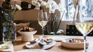 a bottle of wine and a glass on a table at Casa Lerma in Mexico City