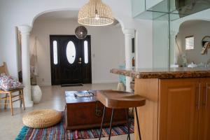 a kitchen with a counter and a table in a room at Stay Near Miami's Cultural Heart With Wifi in Miami +87 photos