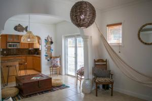 a living room with a table and a kitchen at Stay Near Miami's Cultural Heart With Wifi in Miami