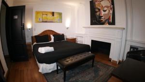 a bedroom with a bed and a fireplace at Tremo Bellavista in Santiago +291 photos