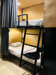 a room with two bunk beds and a ladder to a bunk bed at Hiri Hideout in Dickwella +28 photos