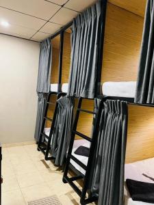 a row of bunk beds in a room at Hiri Hideout in Dickwella