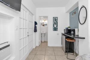 a kitchen with a counter and a sink in a room at Private Studio in Little Havana in Miami +44 photos