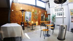 a restaurant with a table and chairs in a room at Tremo Bellavista in Santiago