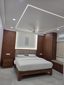 a bedroom with a bed in a room at The Sanctuary by exot in Visakhapatnam +7 photos