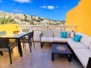 a living room with a couch and a table at Veiw Luxury Apartment in Adeje