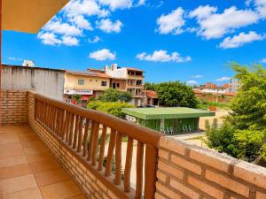 a balcony with a view of a building at Pousada Wilclé Center Preá in Prea