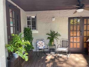 a porch with chairs and plants on a house at Private room in the Heart of Little Havana for 4 Guests in Miami