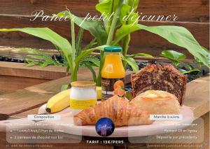 a plate of food with bread and other food items at La Cabane de l'Explorateur - Hébergement insolite avec spa in Cholet
