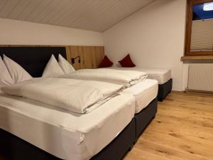 two twin beds in a room with at Appartements Lenzikopf in Brand +51 photos