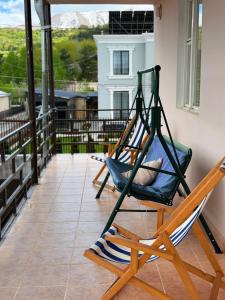 two hammocks on a balcony with a view at MARY in Stepʼanavan