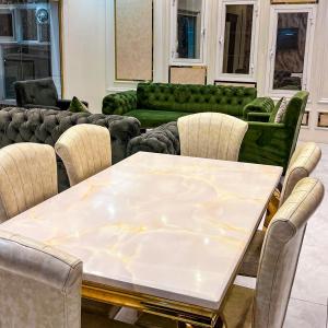 a dining room with a table and chairs at فلل أرياف - Aryaf in Abha +117 photos