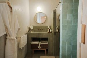 a bathroom with a sink and a mirror at Hotel Hércules in Querétaro +89 photos