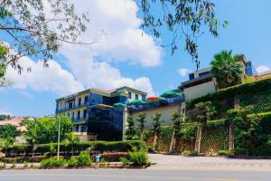 a building on the side of a hill at Lemon hills hotel in Runda