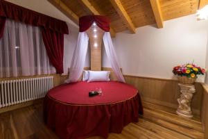 Postel nebo postele na pokoji v ubytování B&B Al Cedro