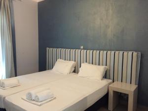 Postel nebo postele na pokoji v ubytování Ionion Beach Apartment Hotel & Spa