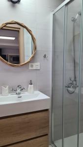 a bathroom with a sink and a mirror at Vacaciones de ensueño in Mojácar +15 photos