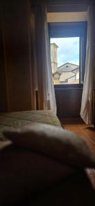 Llit o llits en una habitació de Hotel Natros