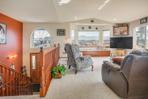 a living room with a couch and a chair at Charming Sequim House w/ Olympic Peninsula Views! in Sequim