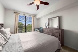 a bedroom with a bed and a dresser and a mirror at Spacious Blessed HOME for blessed guests at the Domain in Austin +56 photos