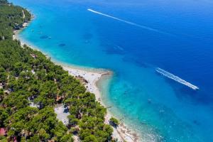 an aerial view of a beach with boats in the water at Alemaris Resort in Baška Voda