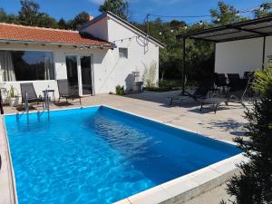 a swimming pool in the backyard of a house at Djordjevic house in Jagodina