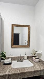 a bathroom with a sink and a mirror at Villa Privada 1200m2 Laguna a Pasos Pet Friendly in Xul-Ha +24 photos