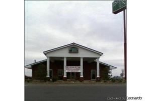 a building with a sign on top of it at Deerfield Inn & Suites Steele Near Blytheville I-55 in Steele