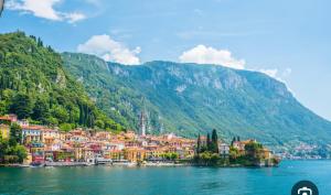 a town on the shore of a body of water at Lora Luxury Suite 6 ,free private parking, self check in, air conditioner in Como