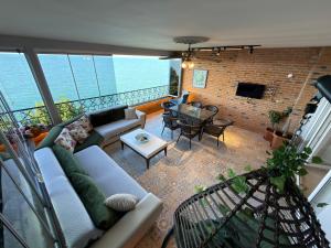 a living room with a couch and a table at My White Residence in Trabzon