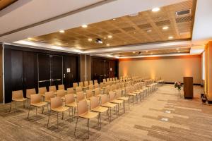 a conference room with rows of chairs and a podium at Veranda Hotel Vina del Mar in Viña del Mar +34 photos
