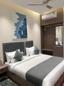a bedroom with a large bed in a room at Hotel route 54 in Bathinda