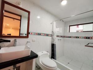 a bathroom with a sink and a toilet and a shower at Kantu hotel in Cusco +118 photos