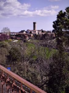 a view of a town with a factory on a hill at Dimora al Civico 35 in Montefano