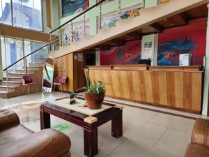 a lobby with a coffee table and a waiting room at Park Place Hotel in Siguatepeque