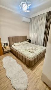 a bedroom with a large bed in a room at Your Home Fier 2 in Fier