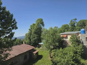 an overhead view of a house and trees at Nice Guest House GPO Murree in Murree