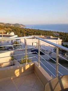 a balcony with a view of the ocean at RAHI Rooms in Gjilek