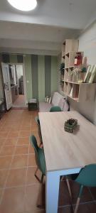 a living room with a table and chairs and a couch at Mazzmarill in Pizzoferrato