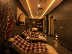 a living room with four couches and a table at Mai İnci Otel in Antalya +86 photos