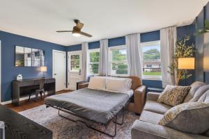 a living room with a couch and a piano at Chic Home with Huge Grassy Yard 7 mins to Arrowhead Stadium in Independence