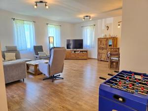 a living room with a couch and a chess board at no 117 Villa Balantis in Vonyarcvashegy
