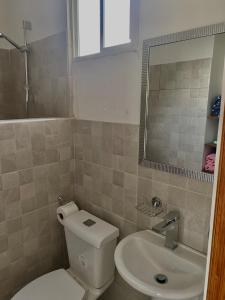 a bathroom with a toilet and a sink at Chill Studio Near Beach Tamarindo in Tamarindo