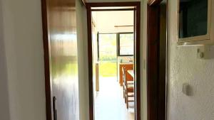an open door to a dining room with a table at Fokianos Gate in Peletá