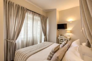 Postel nebo postele na pokoji v ubytování Casa Mia Vaticano Guest House